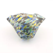 Multicolored glass bowl on a white background