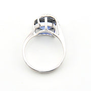 Silver ring with a clear gemstone on a white background