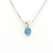 Teardrop-shaped blue gemstone necklace on a white background