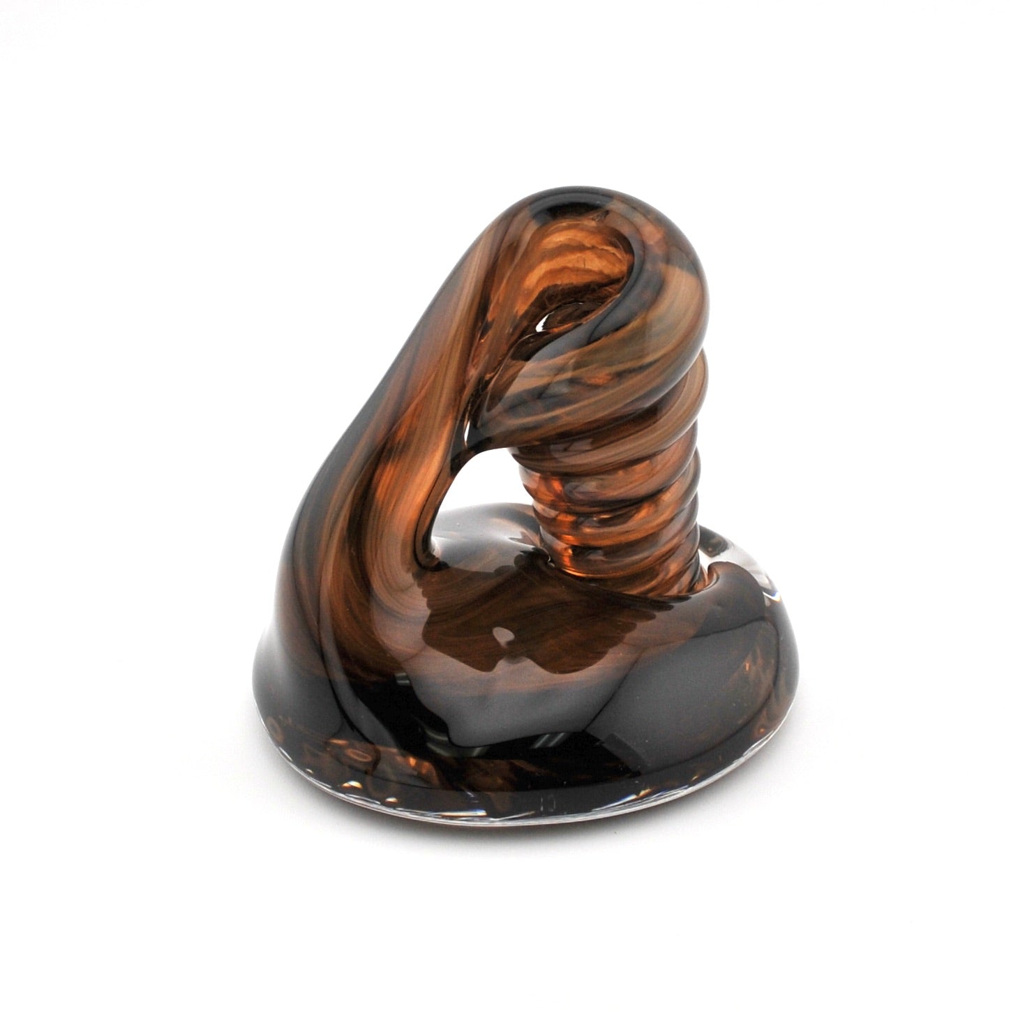 Glass sculpture with brown and black swirl pattern on a white background
