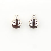 Pair of ladybug-shaped earrings on a white background