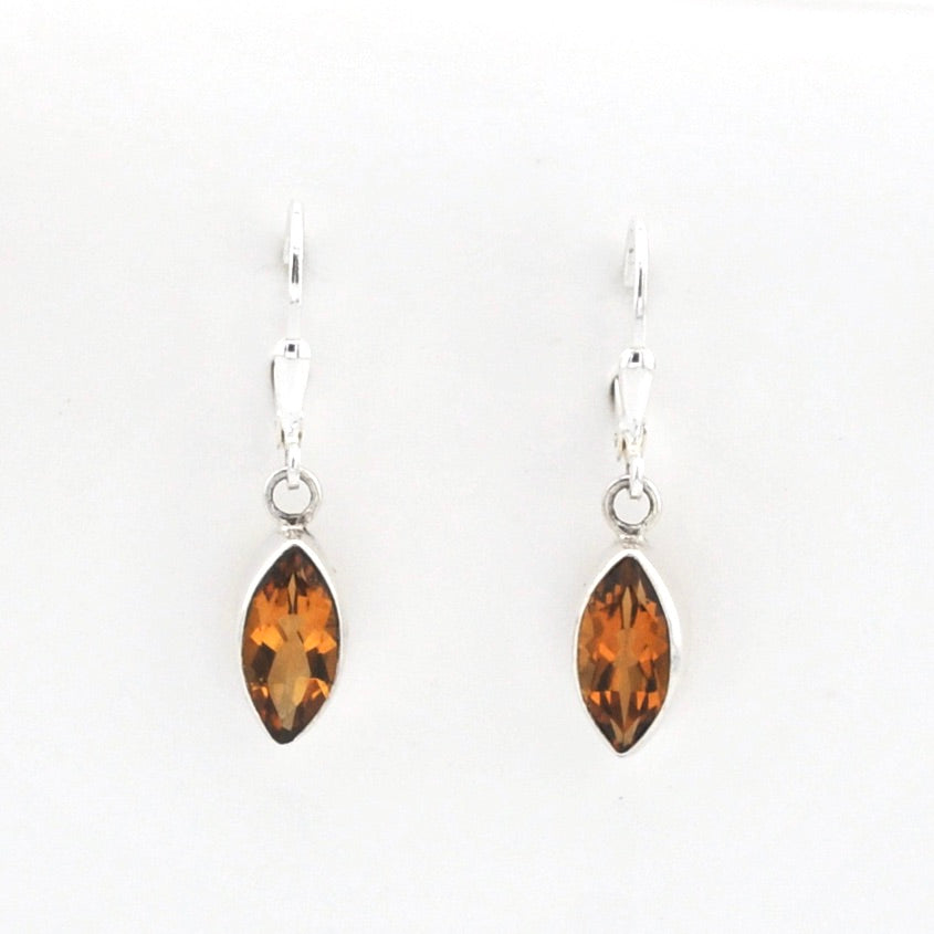 Pair of amber marquise earrings on a white background