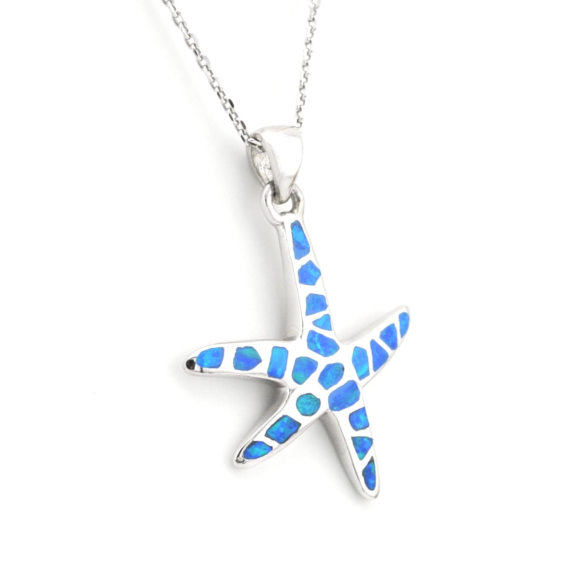 Starfish-shaped pendant with blue inlay on a white background