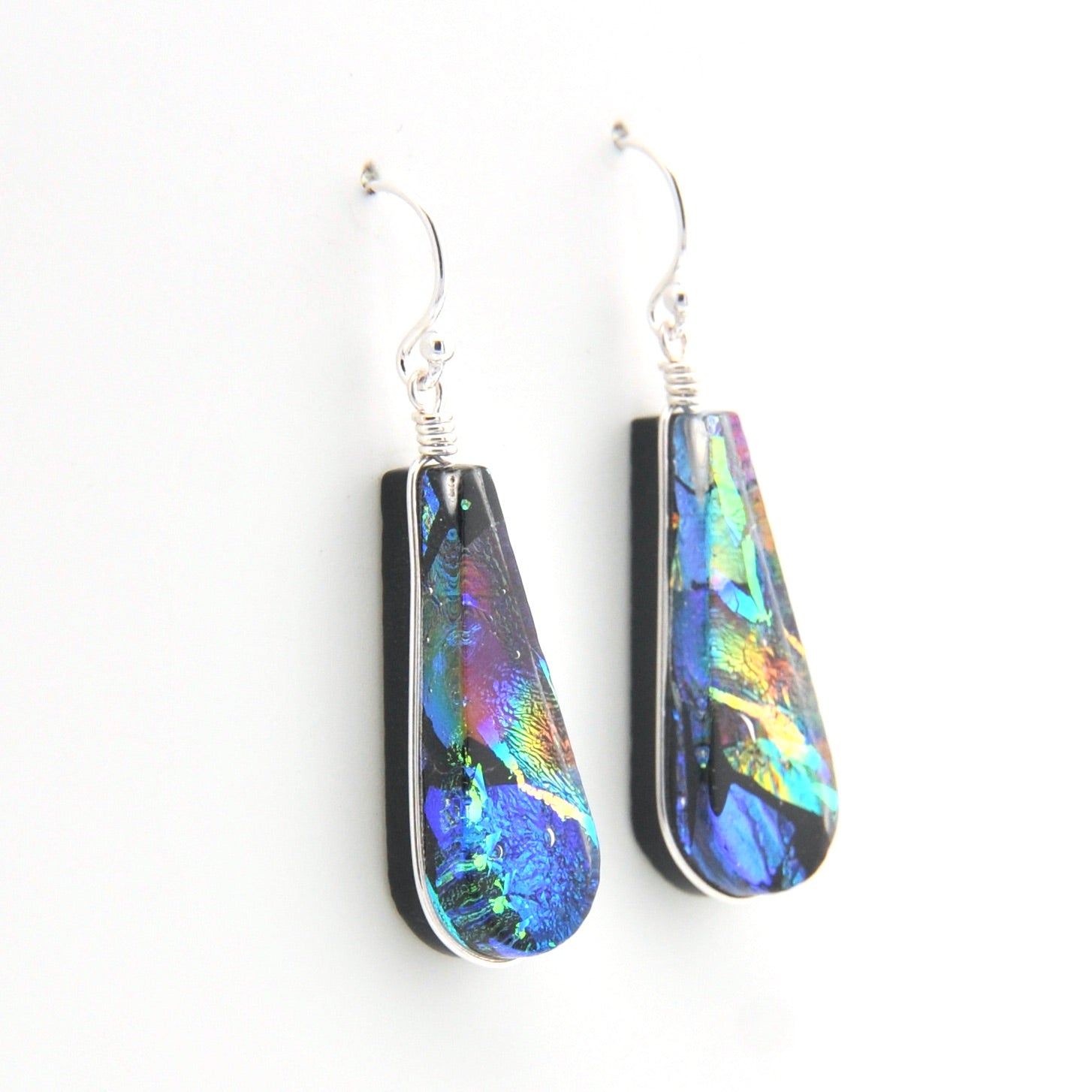 Teardrop-shaped earrings with colorful patterns on a white background