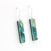 Pair of earrings with colorful rectangular beads on a white background