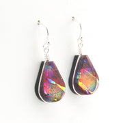 Teardrop-shaped earrings with multicolored iridescent finish on a white background
