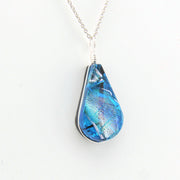 Blue teardrop pendant on a white background