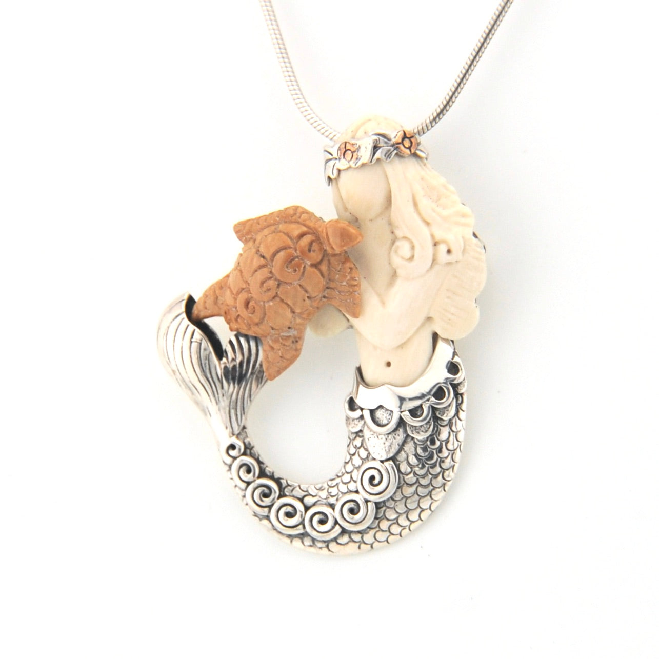 Necklace with a unique pendant featuring a mermaid and turtle on a white background