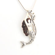 Mermaid tail pendant on a white background