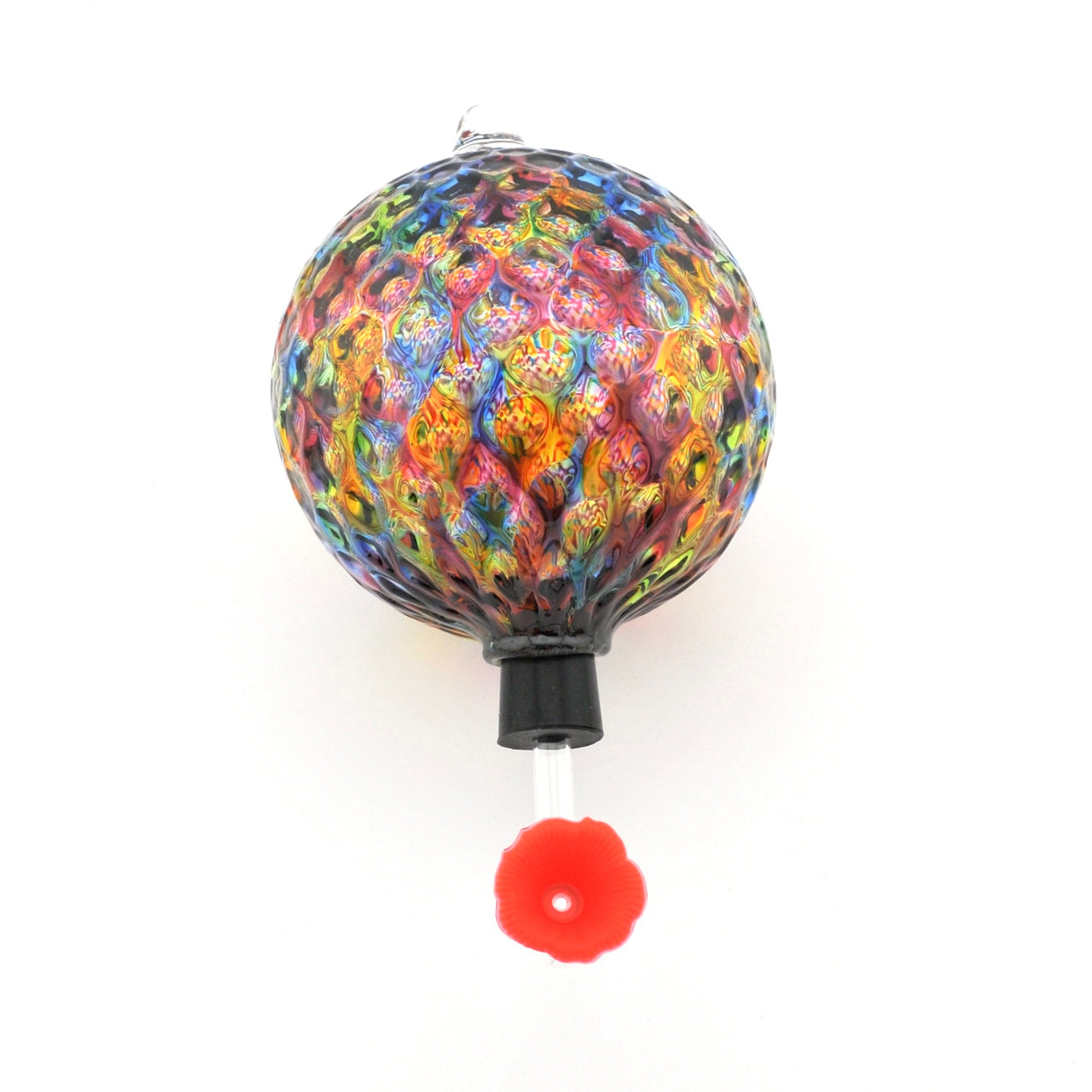 Colorful glass sphere with a red flower on a white background