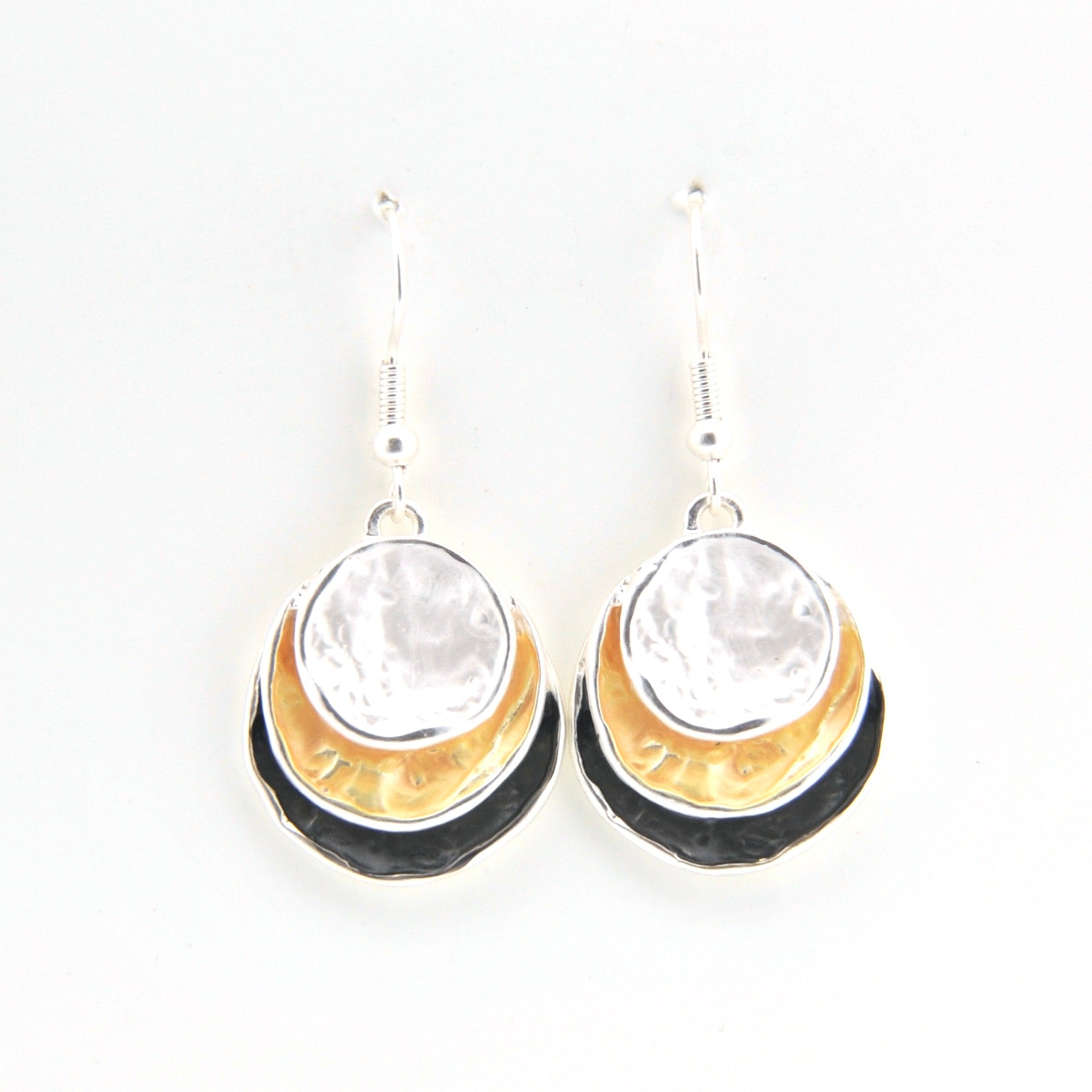 Pair of earrings with gold, black, and clear stone design on a white background