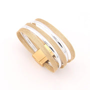 Gold and silver bracelet on a white background