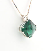 Green gemstone necklace on a white background