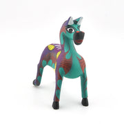 Colorful horse figurine on a white background