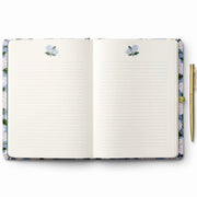 Open notebook with floral design on the cover and pen holder, on a white background