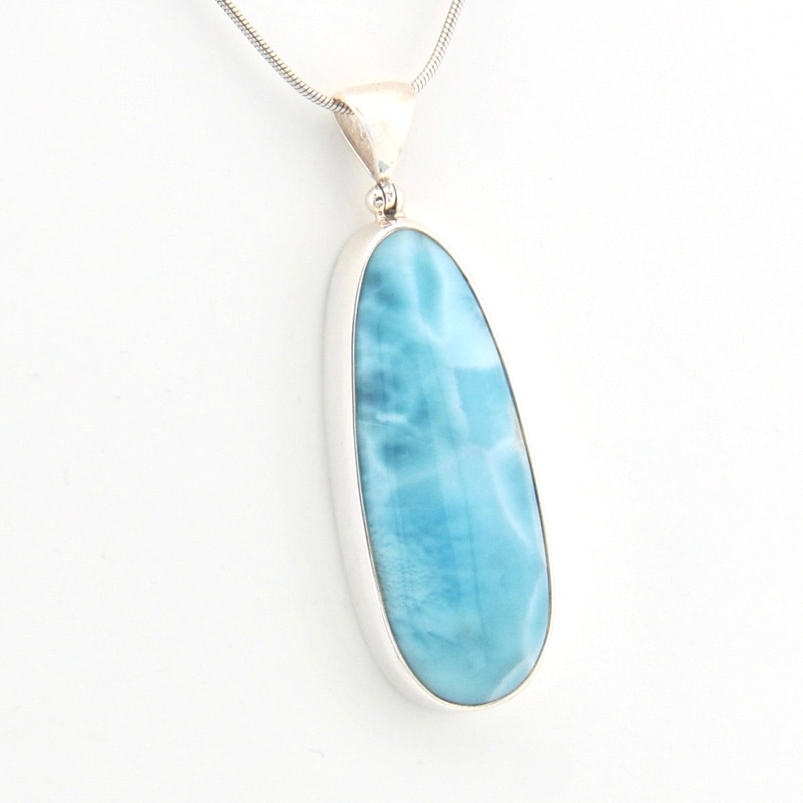 Blue pendant on a white background