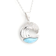 Silver wave pendant with blue accents on a white background