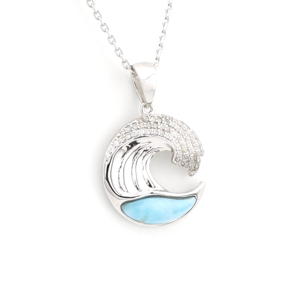 Silver wave pendant with blue accents on a white background