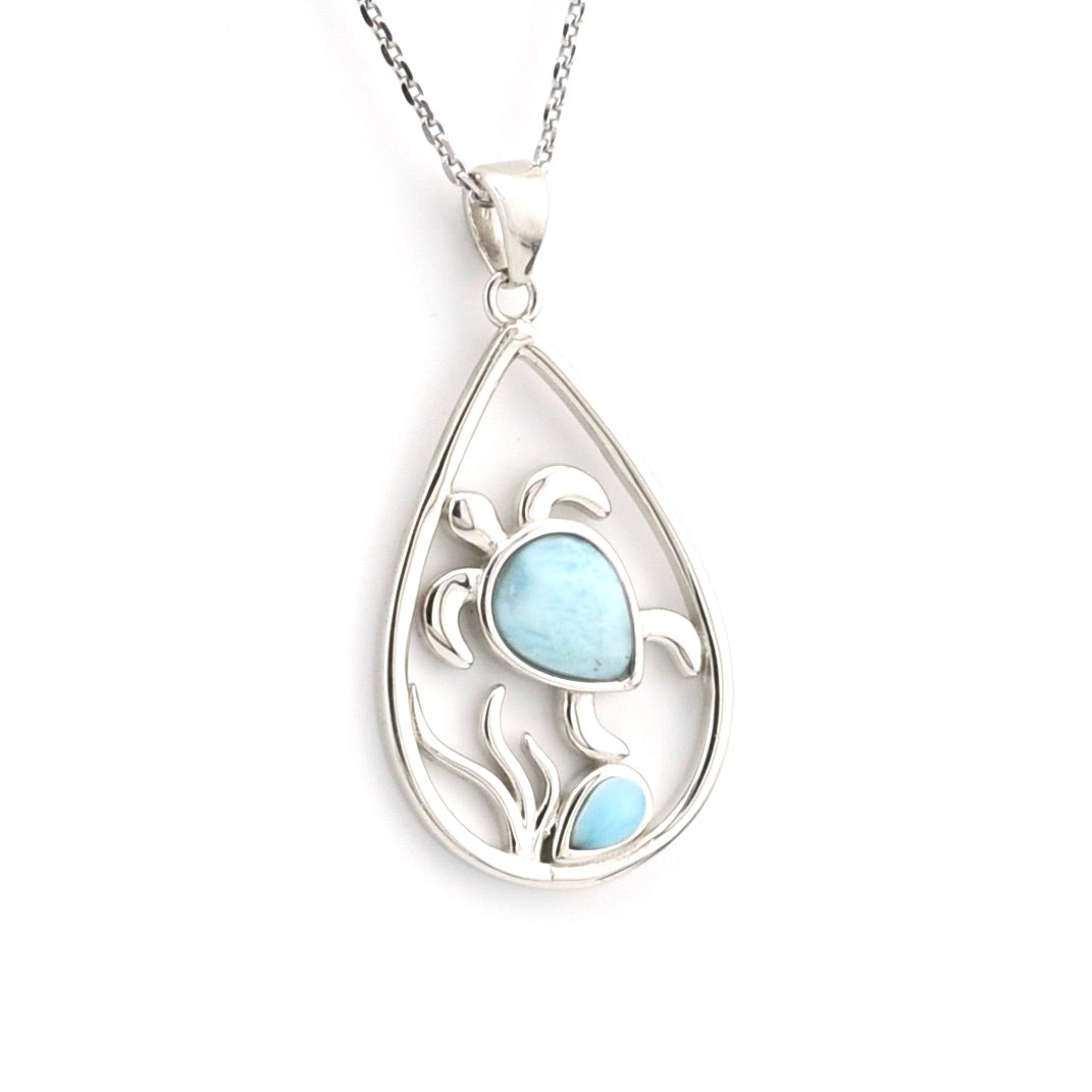 Teardrop-shaped silver pendant with a light blue stone on a white background