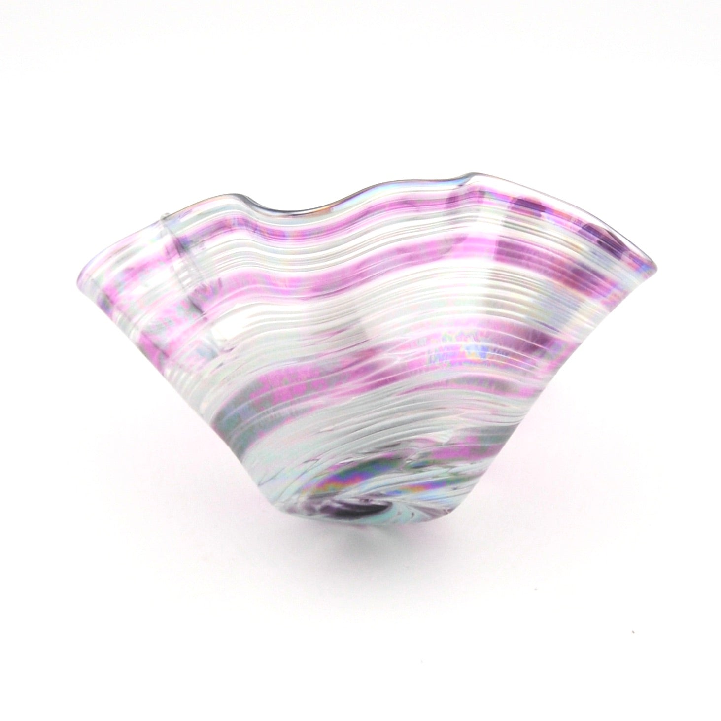 Glass bowl with wavy design and purple and white colors on a white background