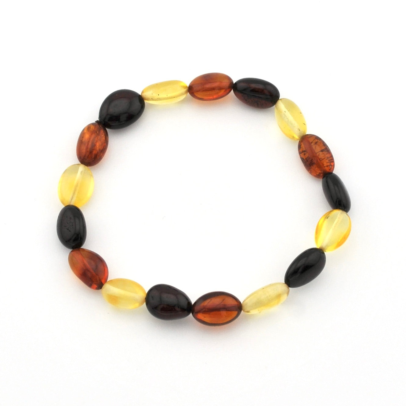 A beaded stretch bracelet made of alternating translucent oval beads in amber brown, deep black, and bright yellow, displayed on a clean white background.