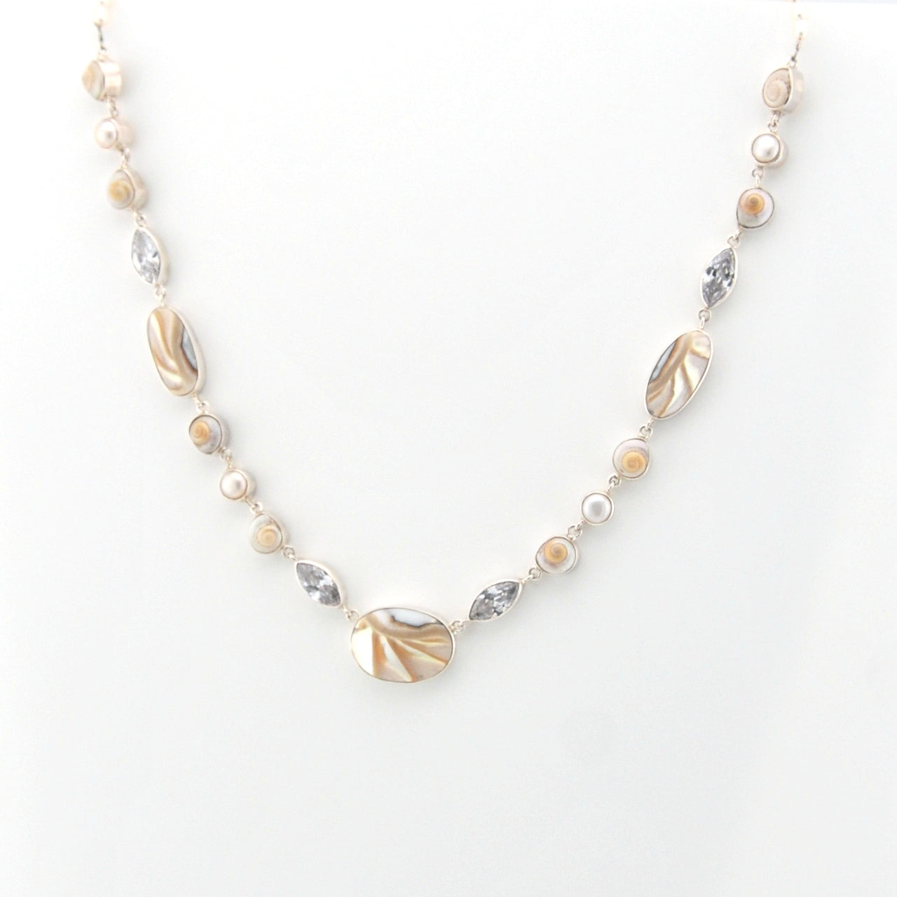 Necklace with shell and pearl on a white background