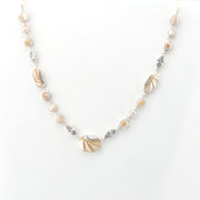 Necklace with shell and pearl on a white background