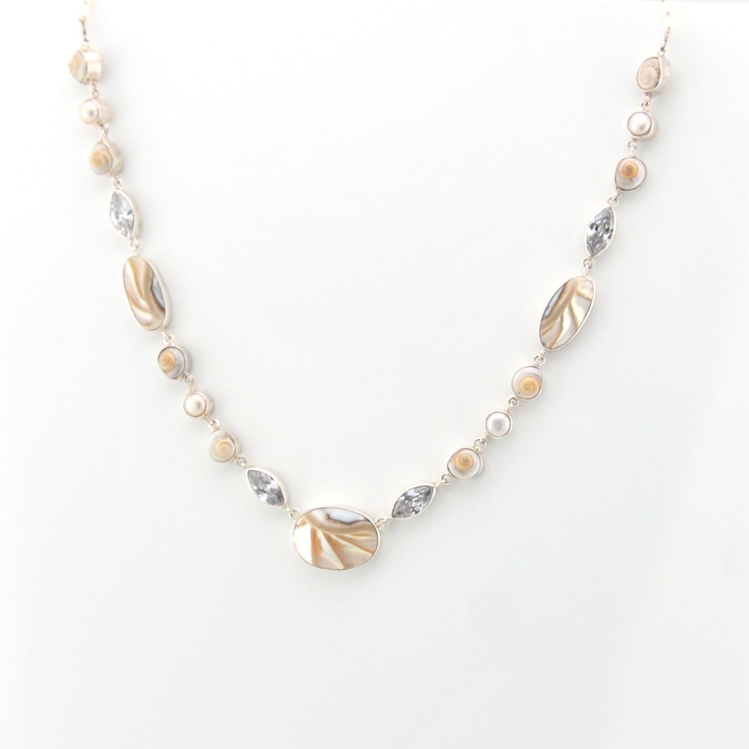 Necklace with shell and pearl on a white background