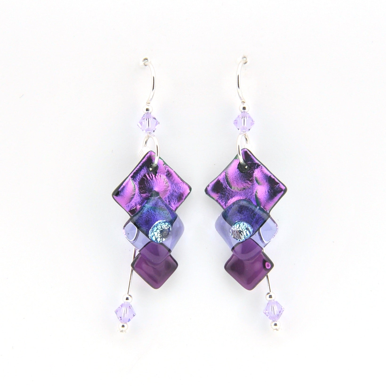 Purple and blue beaded earrings on a white background