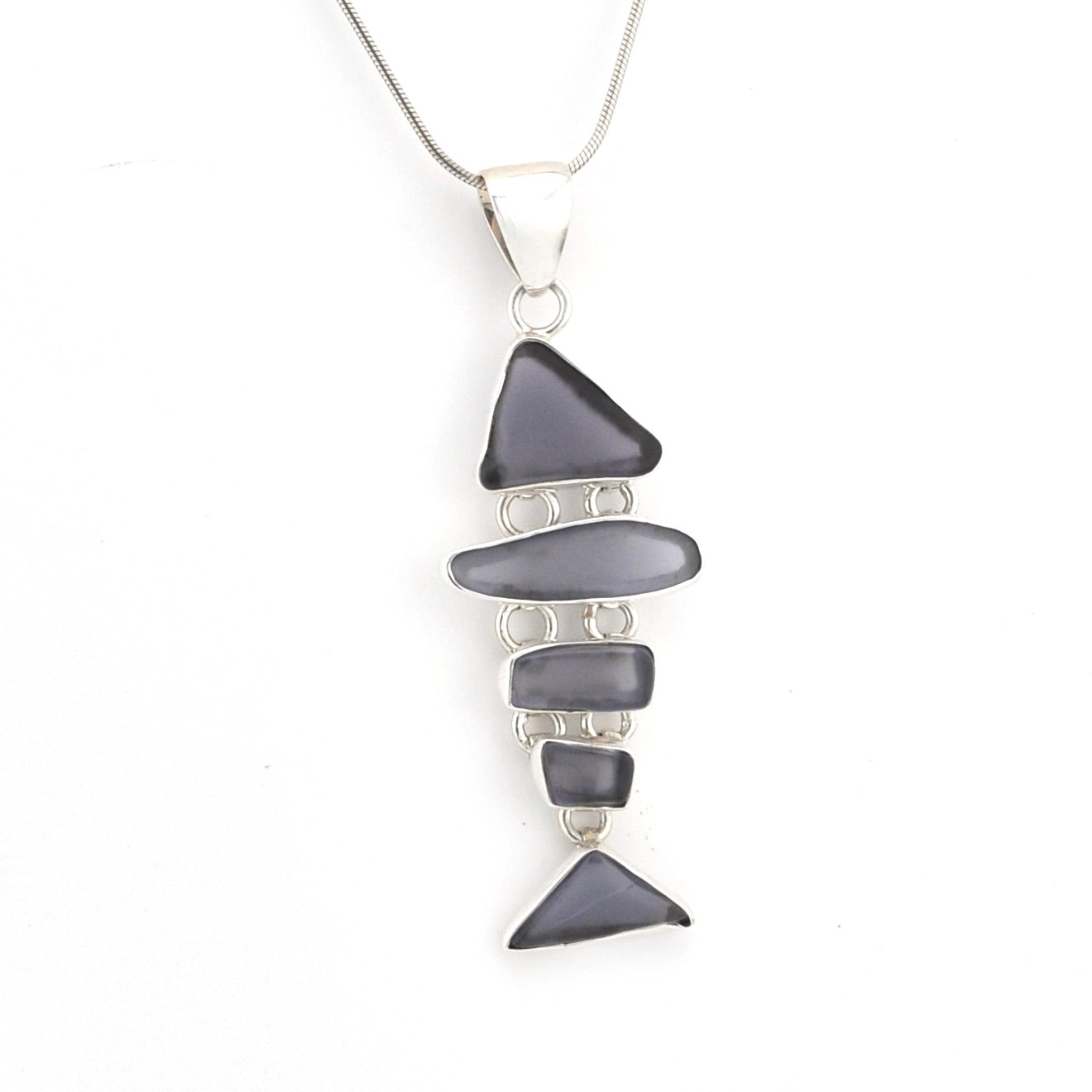 Necklace with layered gray stone pendants on a white background