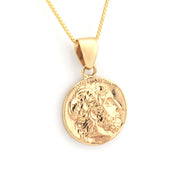 Gold pendant necklace on a white background