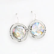 Silver earrings with multicolored glass on a white background