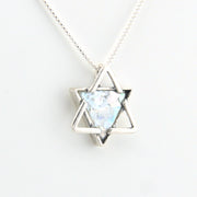 Star-shaped pendant necklace with a light blue stone on a white background