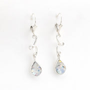 Pair of silver teardrop earrings with Roman glass on a white background