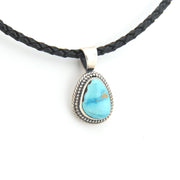 Necklace with a turquoise pendant on a white background