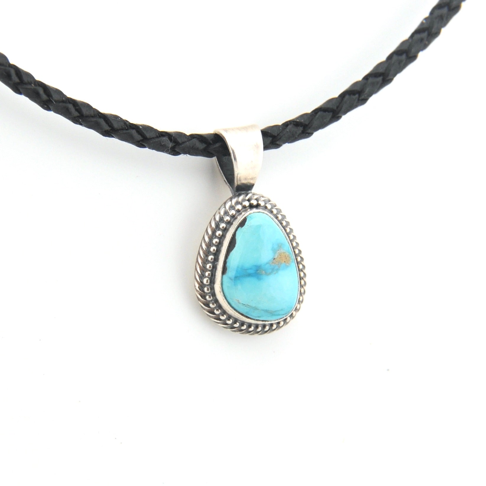 Necklace with a turquoise pendant on a white background