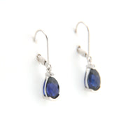 Pair of blue teardrop earrings on a white background