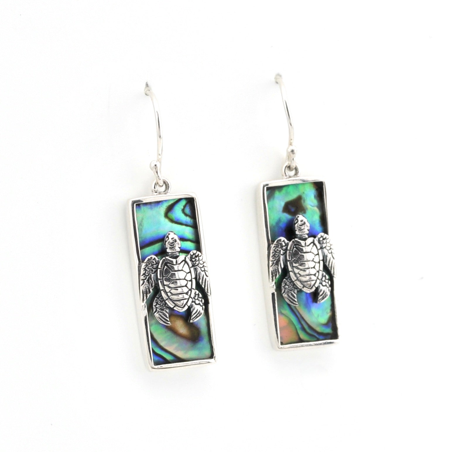 Pair of earrings with turtle design on a white background