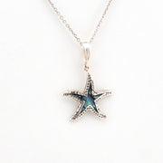 Starfish pendant necklace on a white background