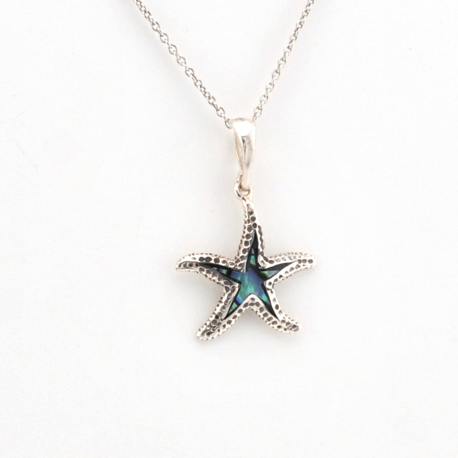 Starfish pendant necklace on a white background