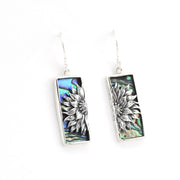 Pair of earrings with floral design on a white background