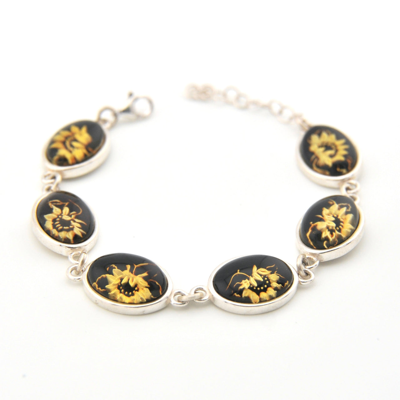 Bracelet with black and gold floral designs on a white background