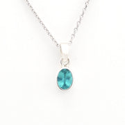 Necklace with a blue pendant on a white background