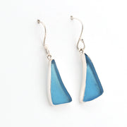 Pair of blue triangular earrings on a white background