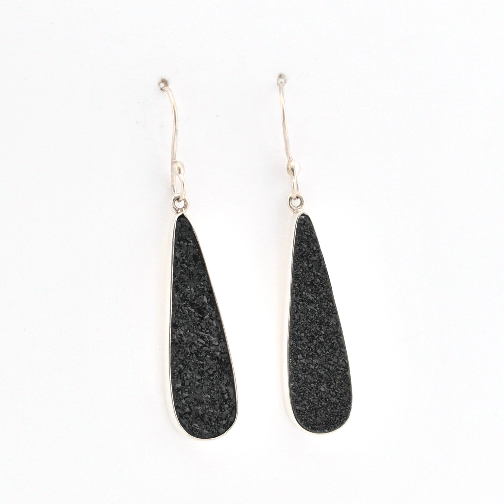 Black teardrop earrings on a white background