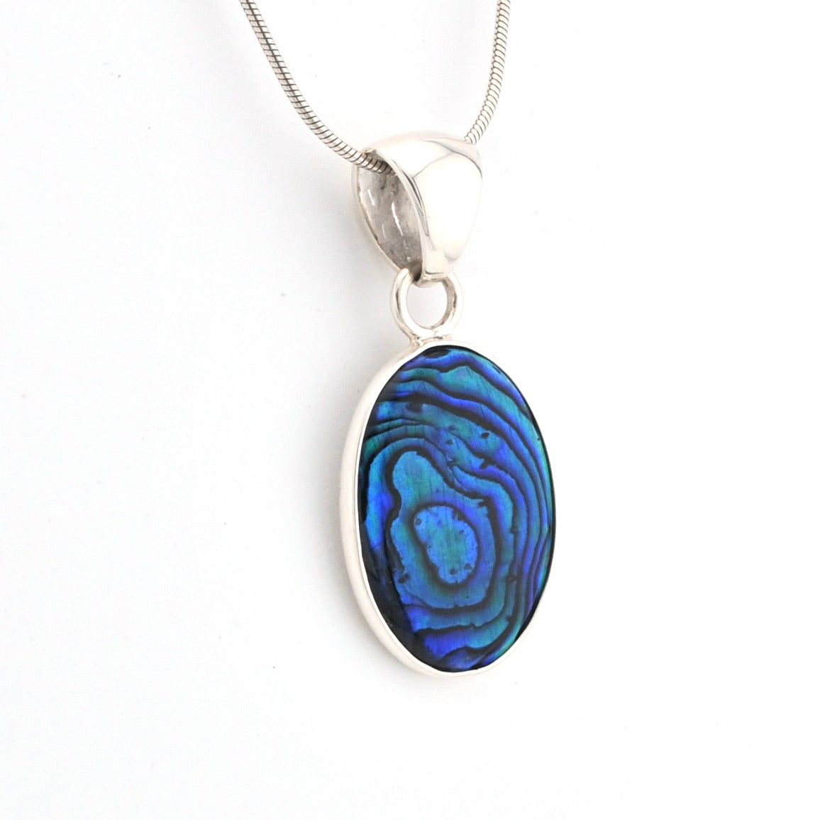 Silver pendant with a blue and green pattern on a white background