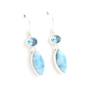 Pair of earrings with blue stones and marquise-shaped stones on a white background