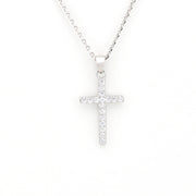 Silver cross necklace on a white background