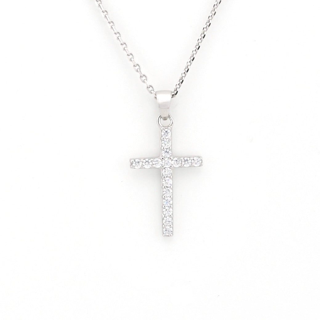 Silver cross necklace on a white background