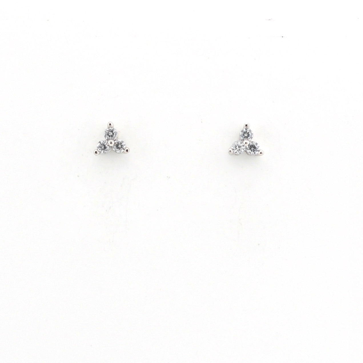 Pair of triangle-shaped earrings with clear stones on a white background